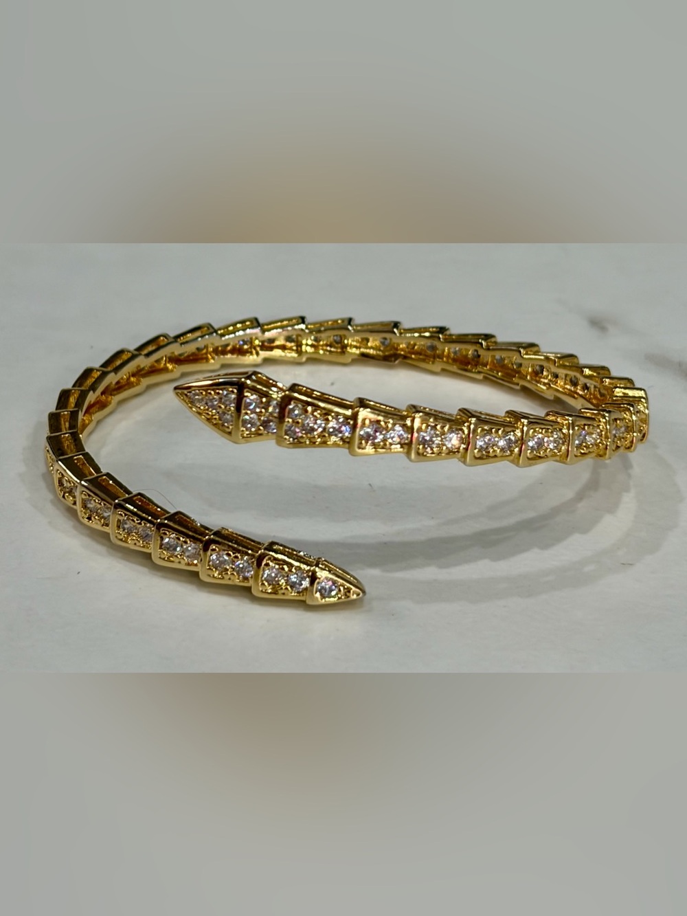 Designer Gold Tone CZ Setpentine Coil Bracelet